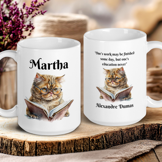 Two white mugs with cat illustrations and text on a wooden surface.