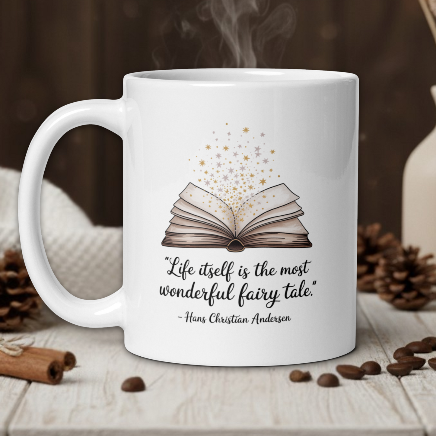 White mug with book design and quote on a wooden table with coffee beans and cinnamon sticks.