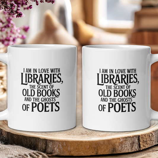 Two white mugs with literary text on a wooden surface with blurred background