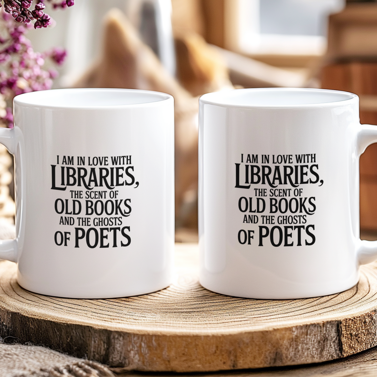 Two white mugs with literary-themed text on a wooden surface.