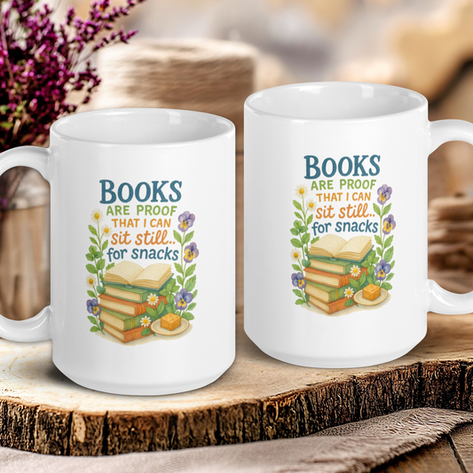 Two white mugs with book-themed designs on a wooden surface.