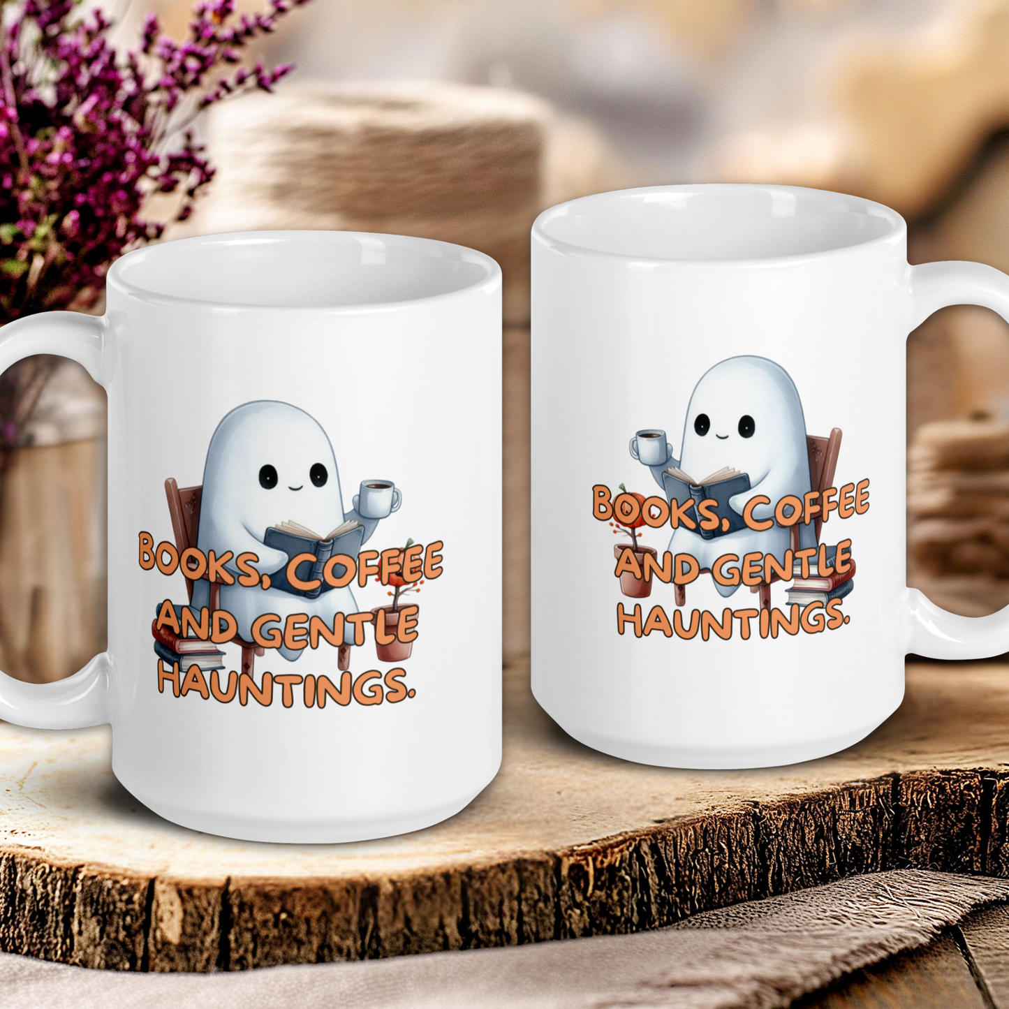 Two white mugs with ghost illustrations and text on a wooden surface.