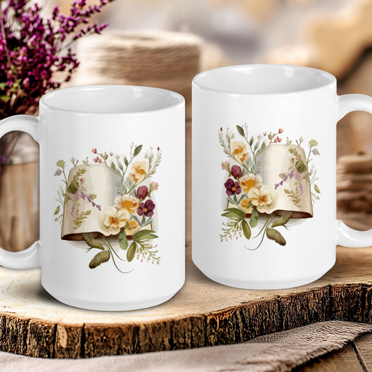 Two white mugs with floral designs on a wooden surface.