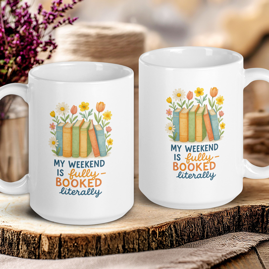 Two white mugs with book-themed designs on a wooden surface.