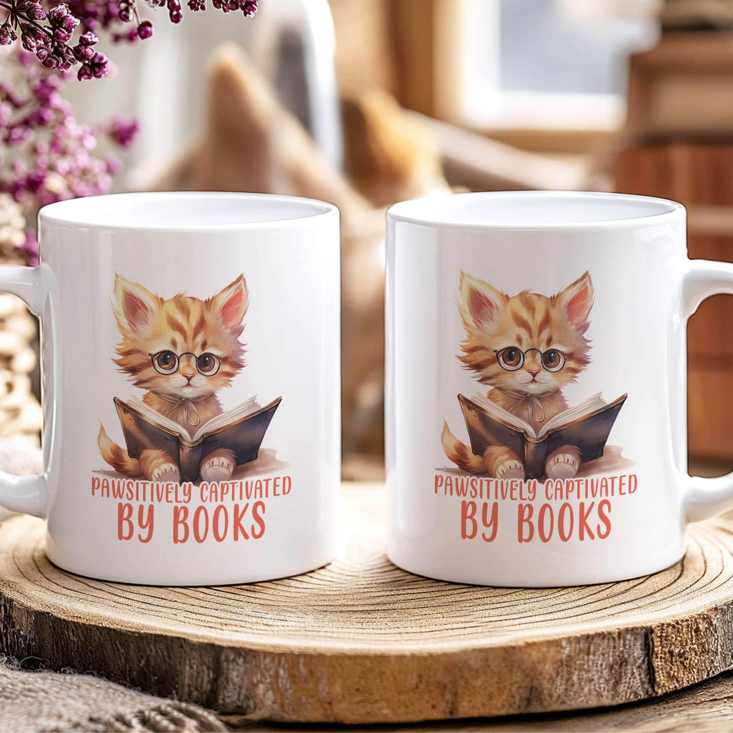 Two mugs with a cat illustration and text 'Pawsitively Captivated by Books' on a wooden coaster.