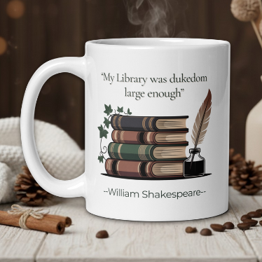 White mug with Shakespeare quote and book design on a wooden table with coffee beans and a vase.