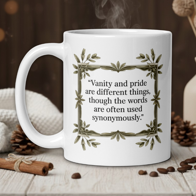 White mug with a quote on a wooden table with coffee beans and a vase in the background