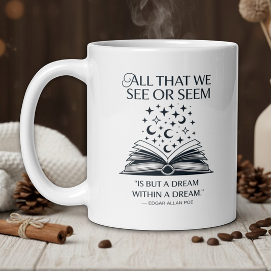 White mug with literary quote and design on a wooden table with coffee beans and a vase in the background.