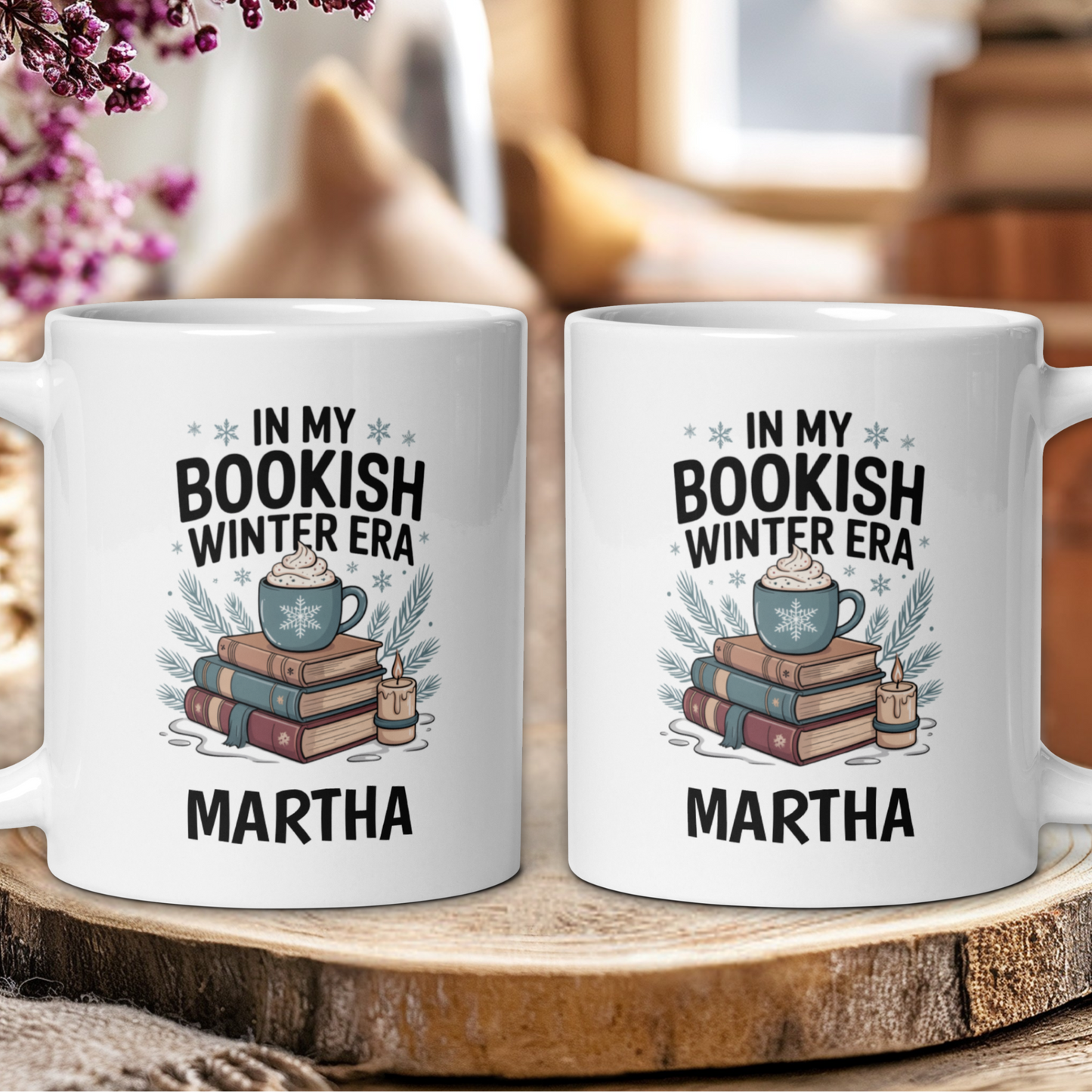 Two white mugs with 'In My Bookish Winter Era' design and 'Martha' text on a wooden surface.