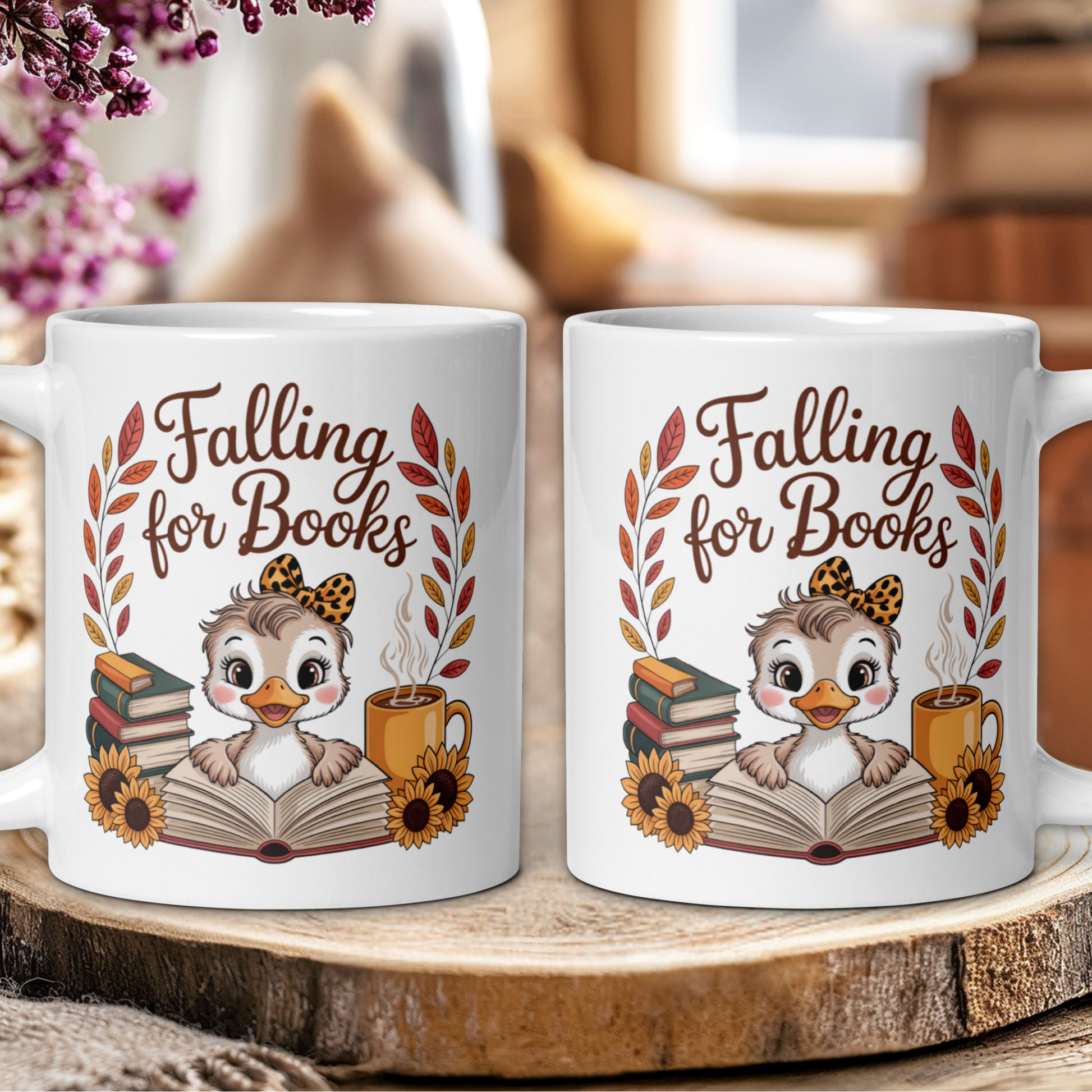 Two mugs with an owl design and 'Falling for Books' text on a wooden surface.