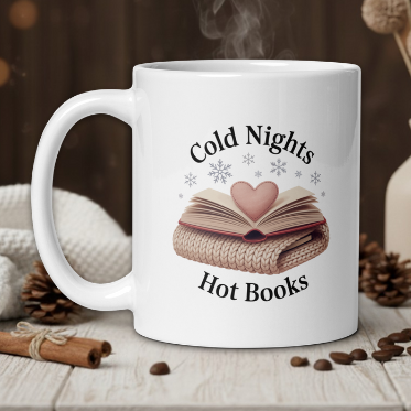 White mug with 'Cold Nights Hot Books' design on a wooden table with cozy background