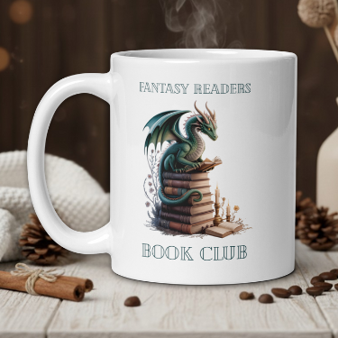 White mug with dragon design and text on a wooden table with coffee beans and a vase.