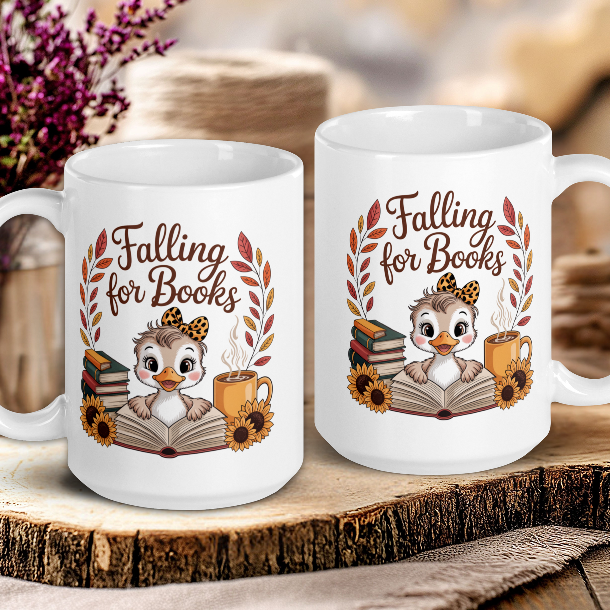 Two white mugs with 'Falling for Books' design featuring an owl and books on a wooden surface.
