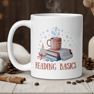White mug with 'Reading Basics' design featuring a cup and books, steaming on a wooden table with cozy background.