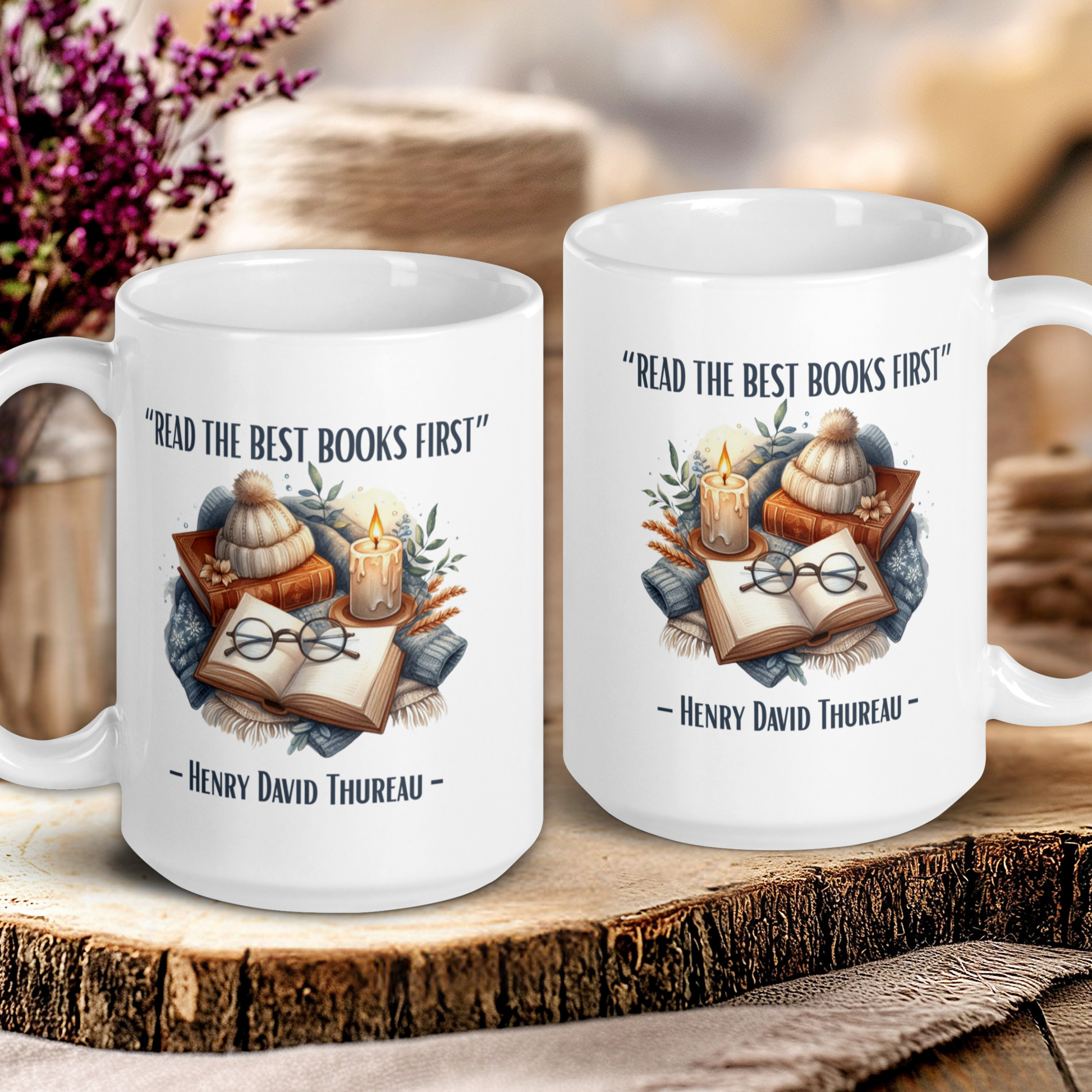 Two white mugs with book-themed designs and quotes on a wooden surface.