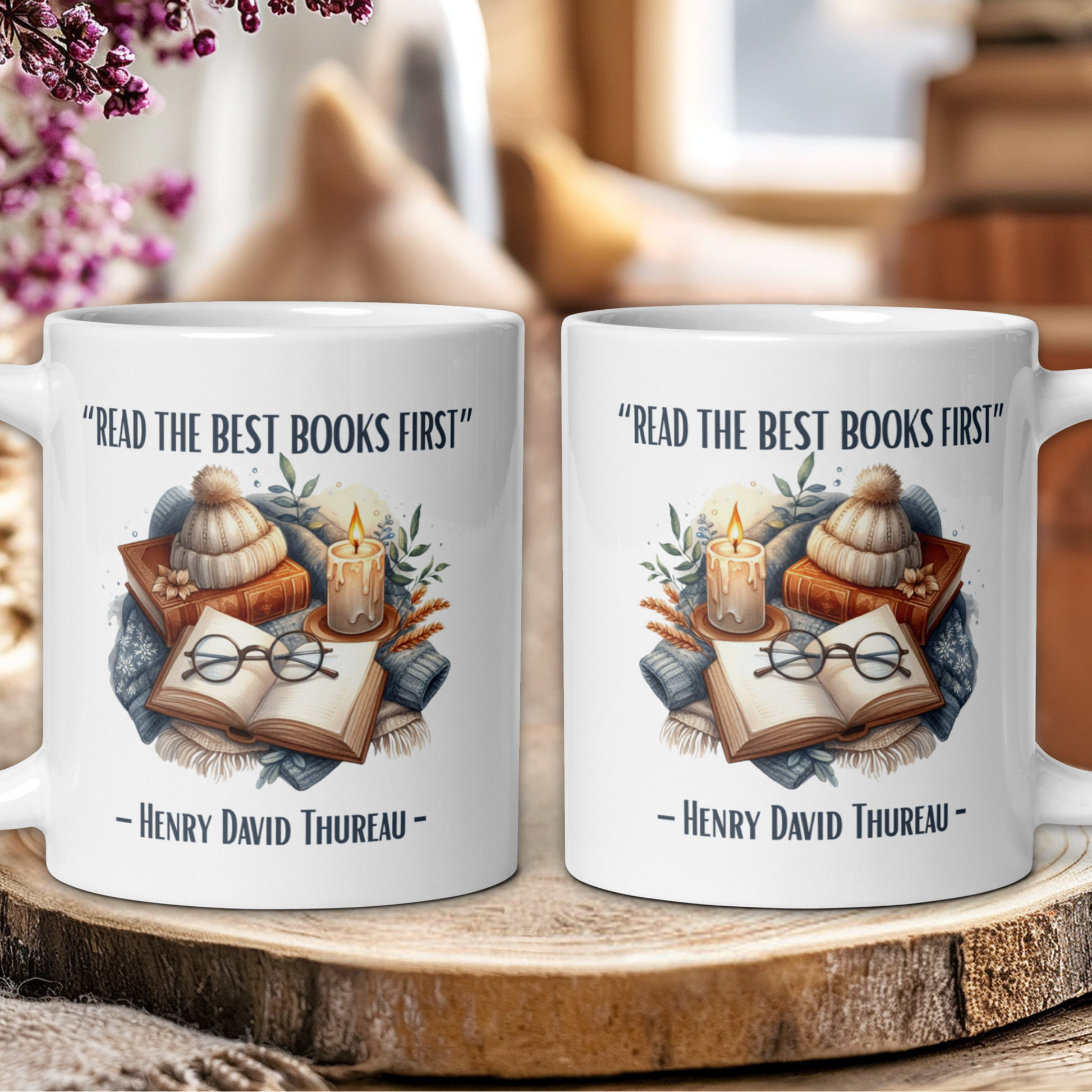 Two mugs with book-themed design and 'Read the best books first' quote on a wooden surface.