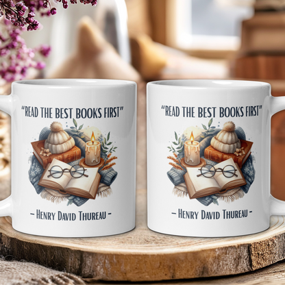 Two mugs with book-themed design and 'Read the best books first' quote on a wooden surface.