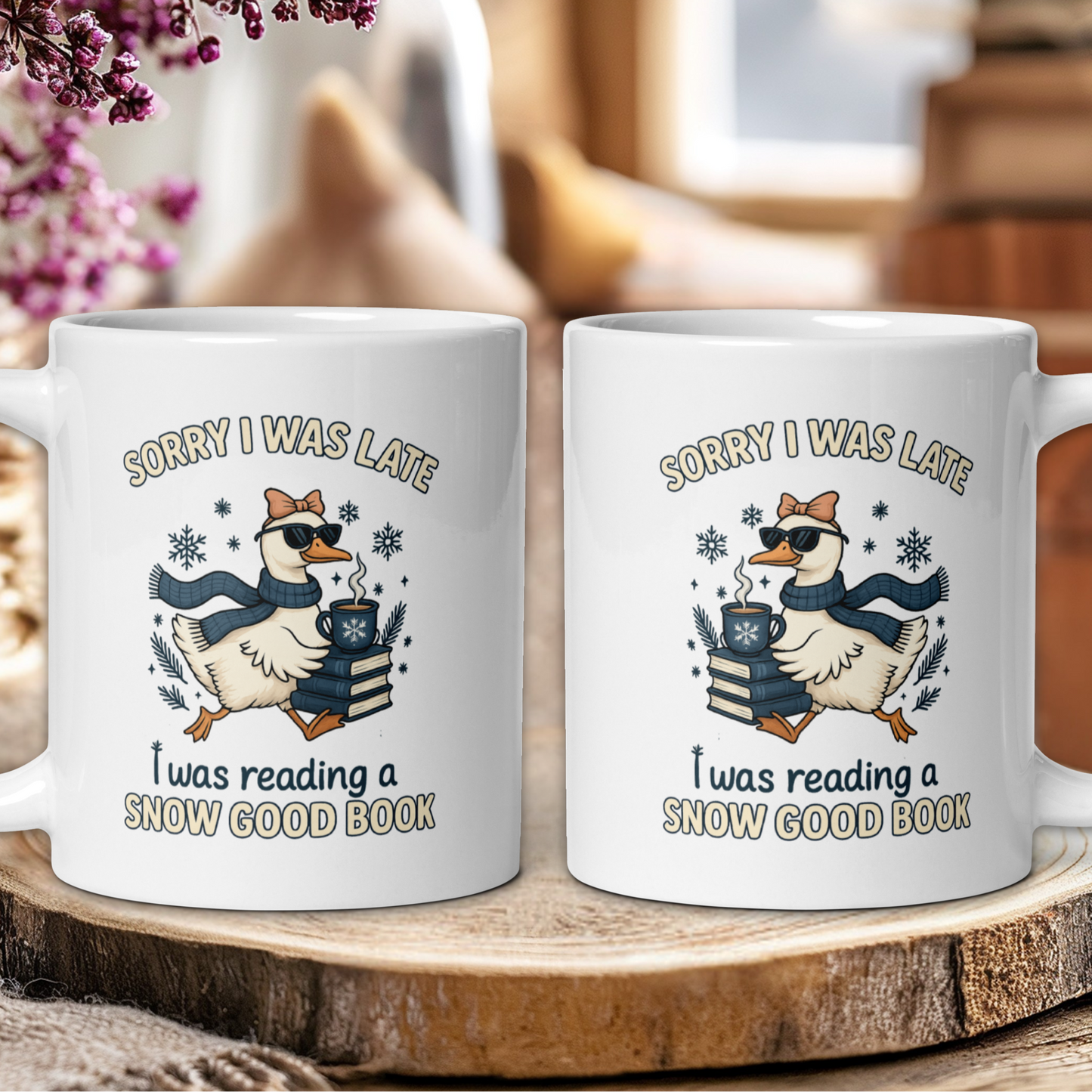 Two white mugs with a cartoon duck and text on a wooden surface.