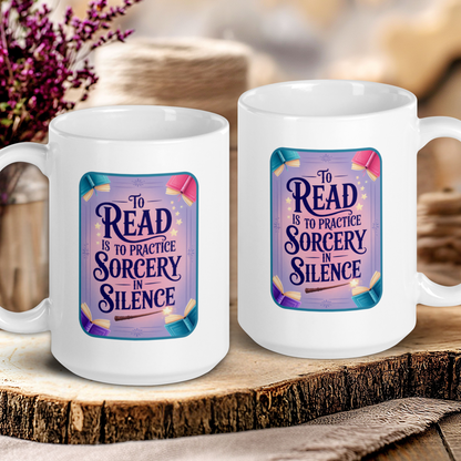 Two white mugs with a decorative design and text on a wooden surface.