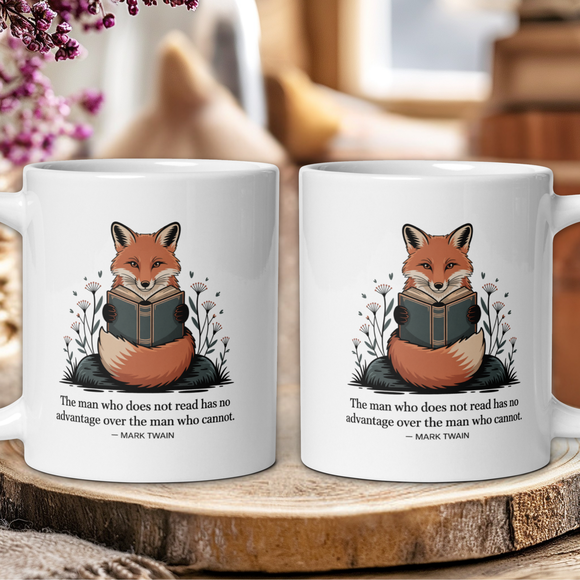 Two white mugs with fox illustrations and Mark Twain quote on a wooden surface.