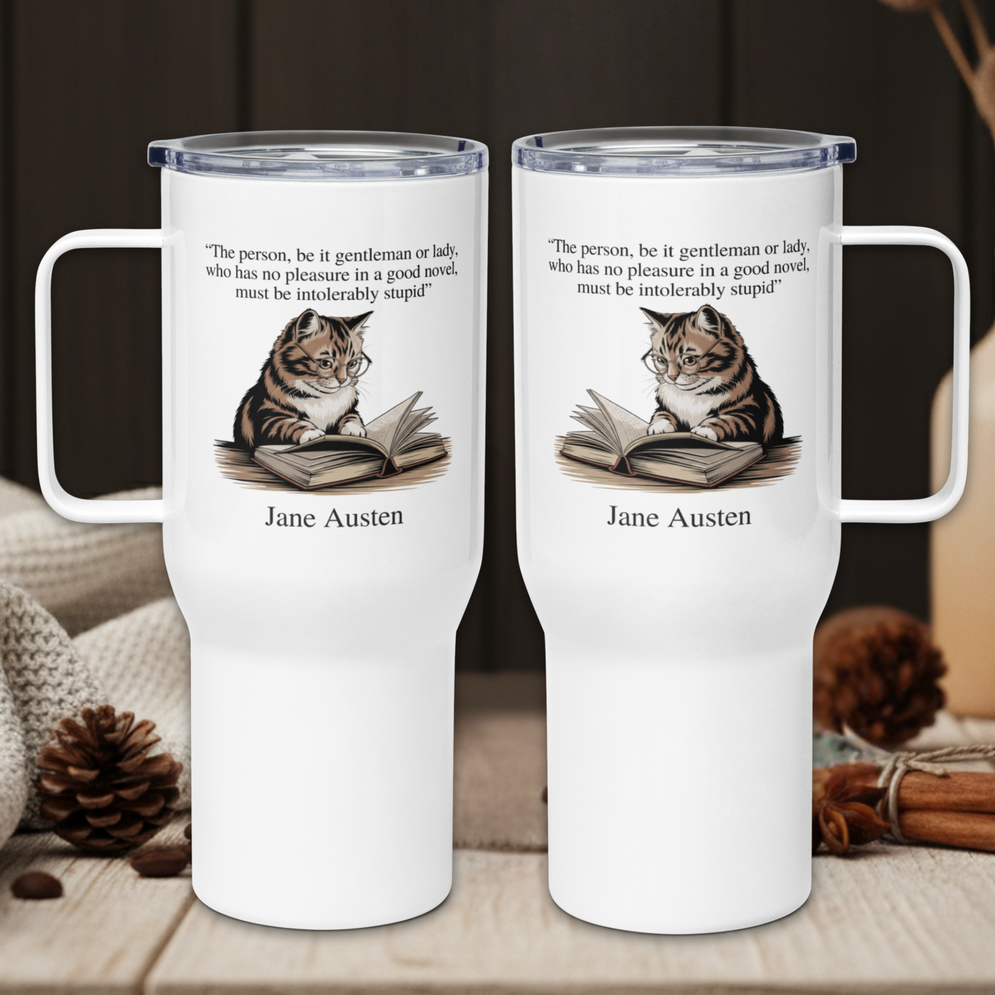 Two white tumblers with a cat reading a book design and Jane Austen quote on a wooden surface.