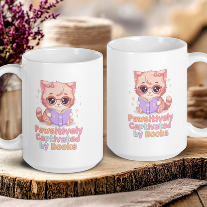 Two white mugs with a cat illustration and text on a wooden surface.