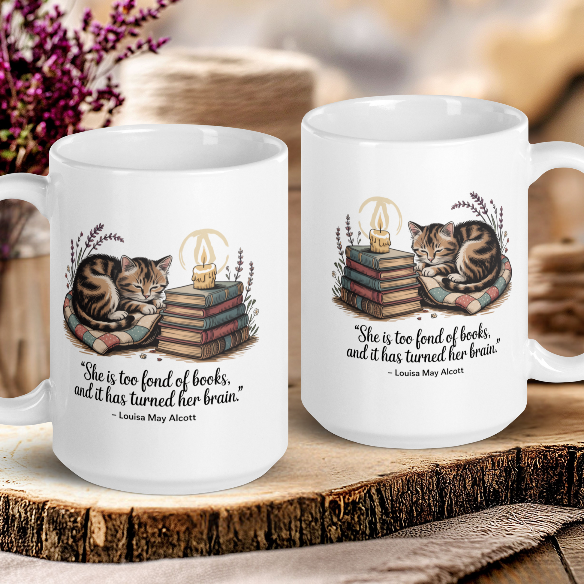 Two mugs with cat illustrations and text on a wooden surface.