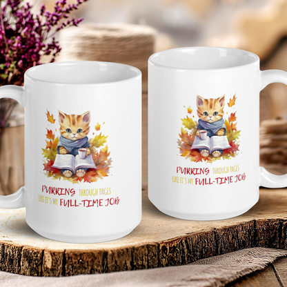 Two white mugs with cat illustrations and text on a wooden surface.