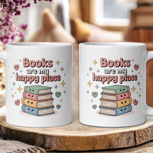 Two white mugs with 'Books are my happy place' design on a wooden surface.