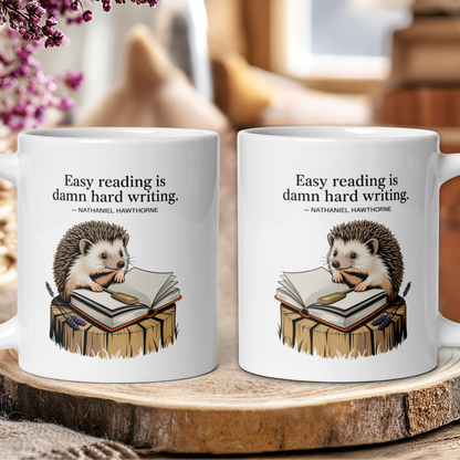 Two mugs with hedgehog illustrations and literary quote on a wooden surface.