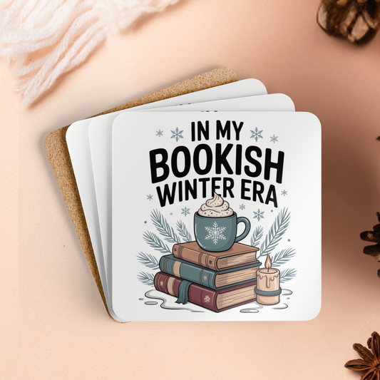 Set of coasters with a book-themed design on a beige surface with autumn decorations.