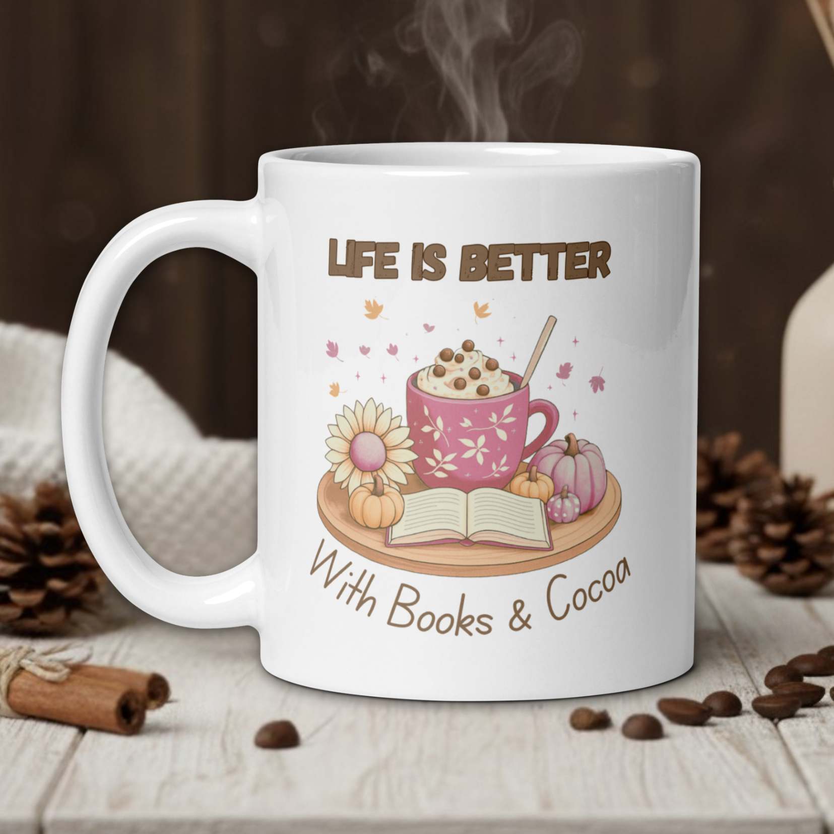White mug with 'Life is Better with Books & Cocoa' design on a wooden table with coffee beans and a vase in the background.