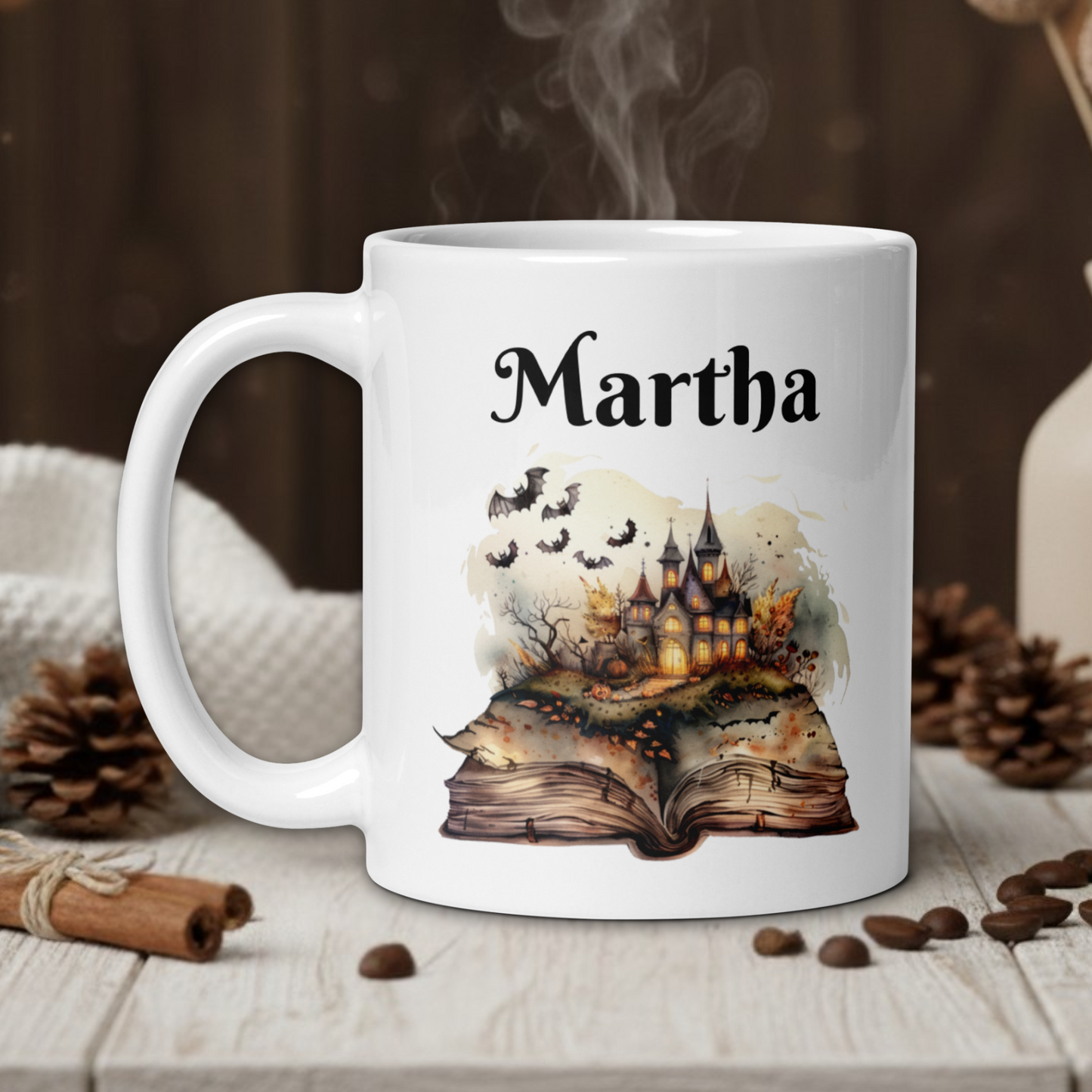 White mug with 'Martha' printed on it, featuring a castle design, on a wooden table with coffee beans and a vase in the background.
