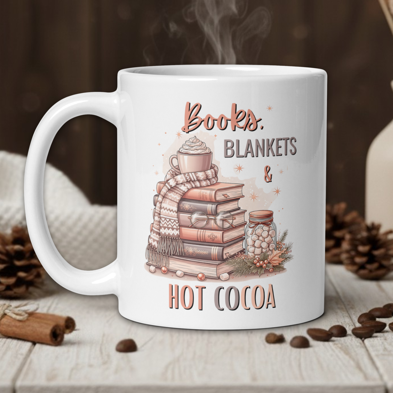 White mug with 'Books, Blankets & Hot Cocoa' design on a wooden table with coffee beans and a vase in the background.
