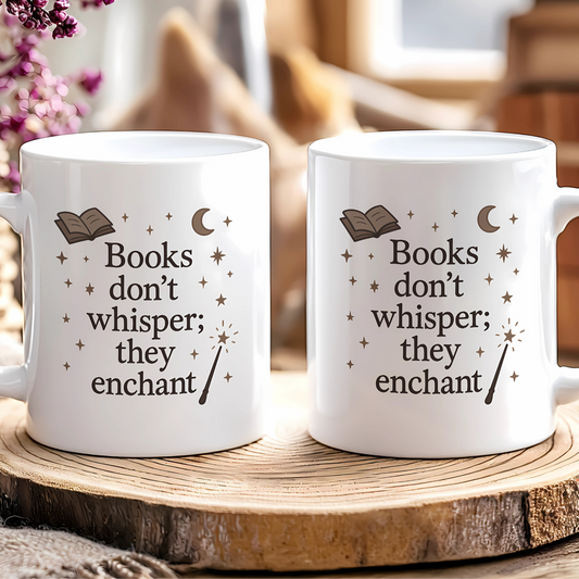 Two white mugs with a book-themed design on a wooden surface.