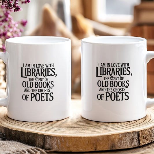 Two white mugs with literary-themed text on a wooden surface.