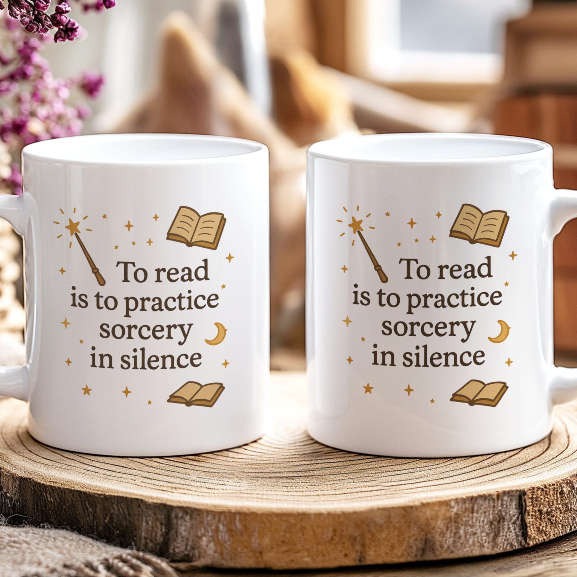 Two white mugs with decorative text on a wooden surface.