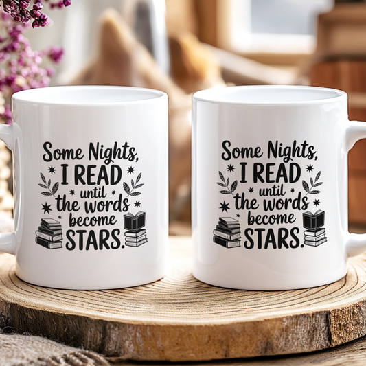 Two white mugs with a literary quote on a wooden coaster.