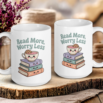 Two white mugs with 'Read More, Worry Less' text and book-themed design on a wooden surface.