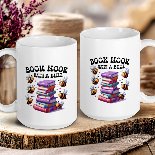 Two white mugs with book-themed designs on a wooden surface.