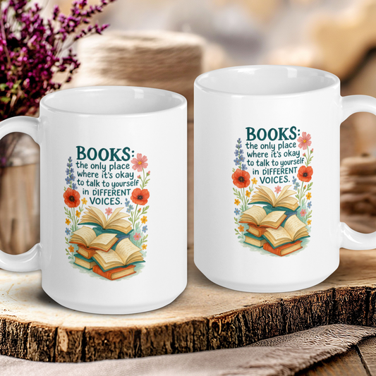 Two white mugs with book-themed designs on a wooden surface.