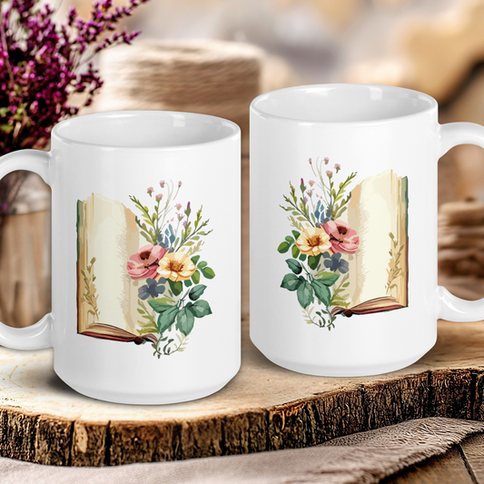 Two white mugs with floral book design on a wooden surface.