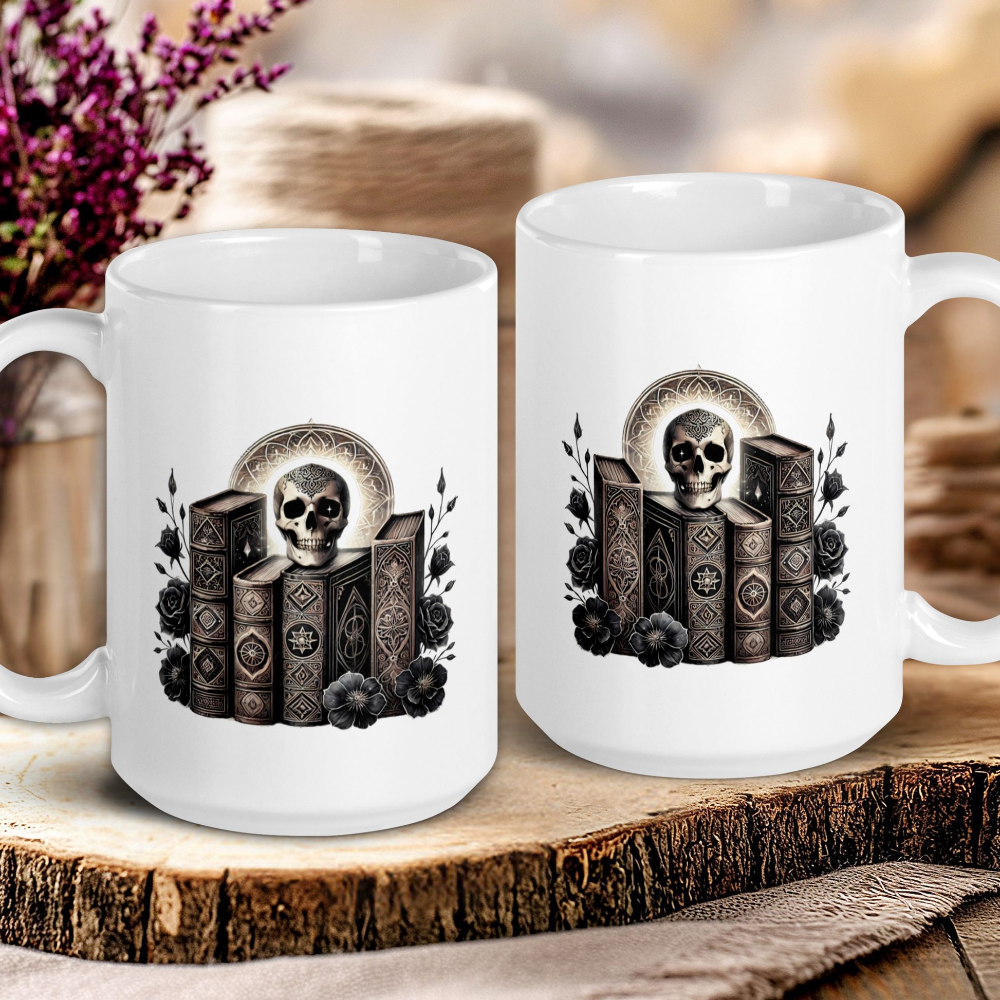 Two white mugs with skull and book design on a wooden surface.
