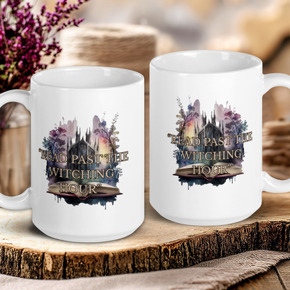 Two white mugs with a witchy design on a wooden surface with flowers in the background.