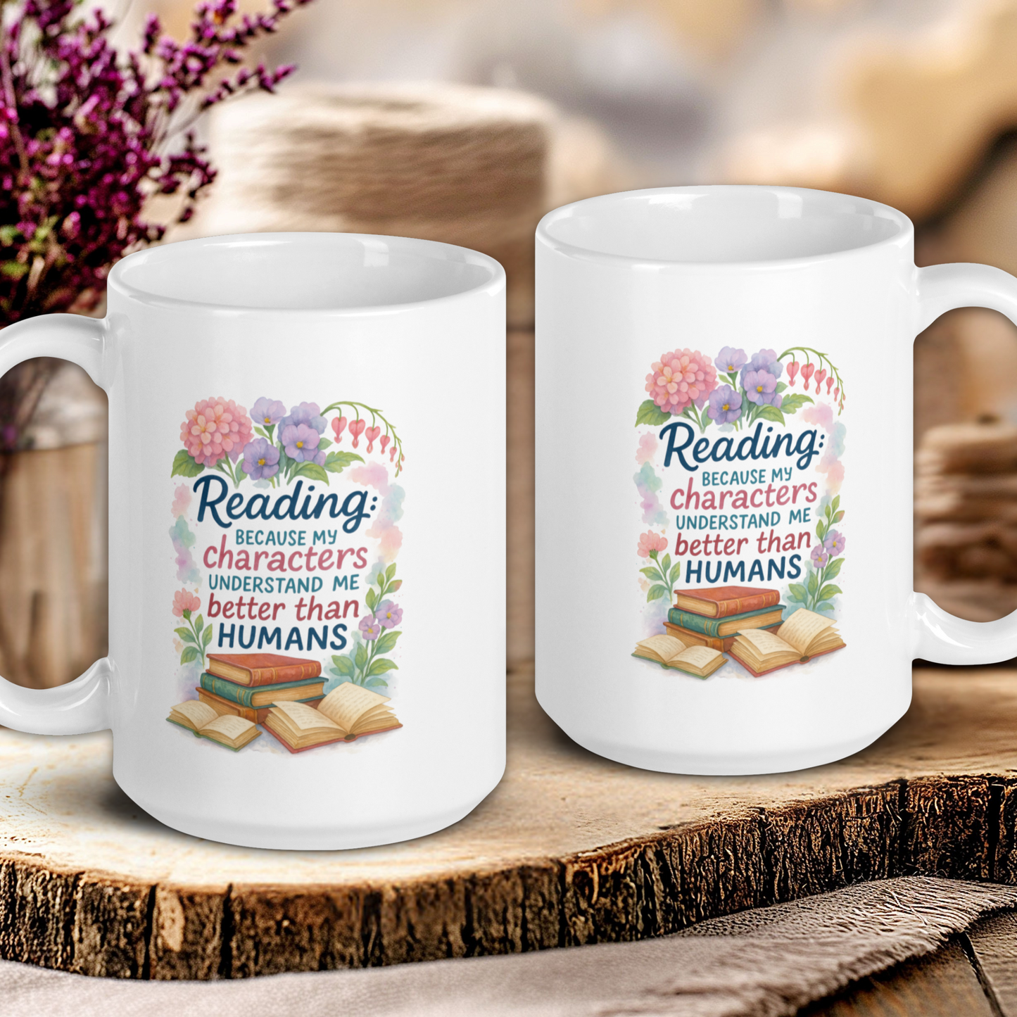 Two white mugs with reading-themed designs on a wooden surface.