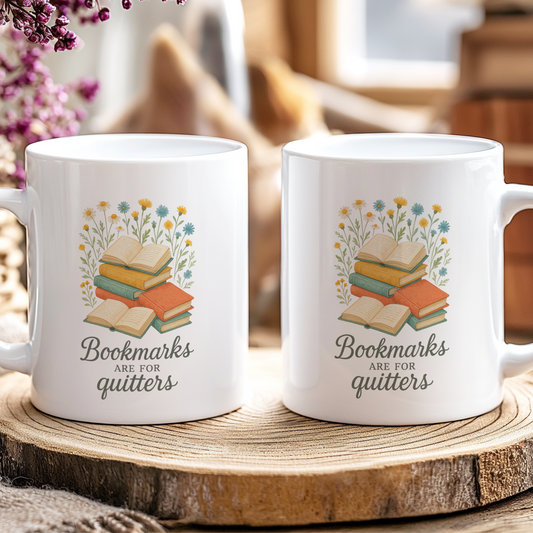 Two white mugs with book-themed design on a wooden coaster.