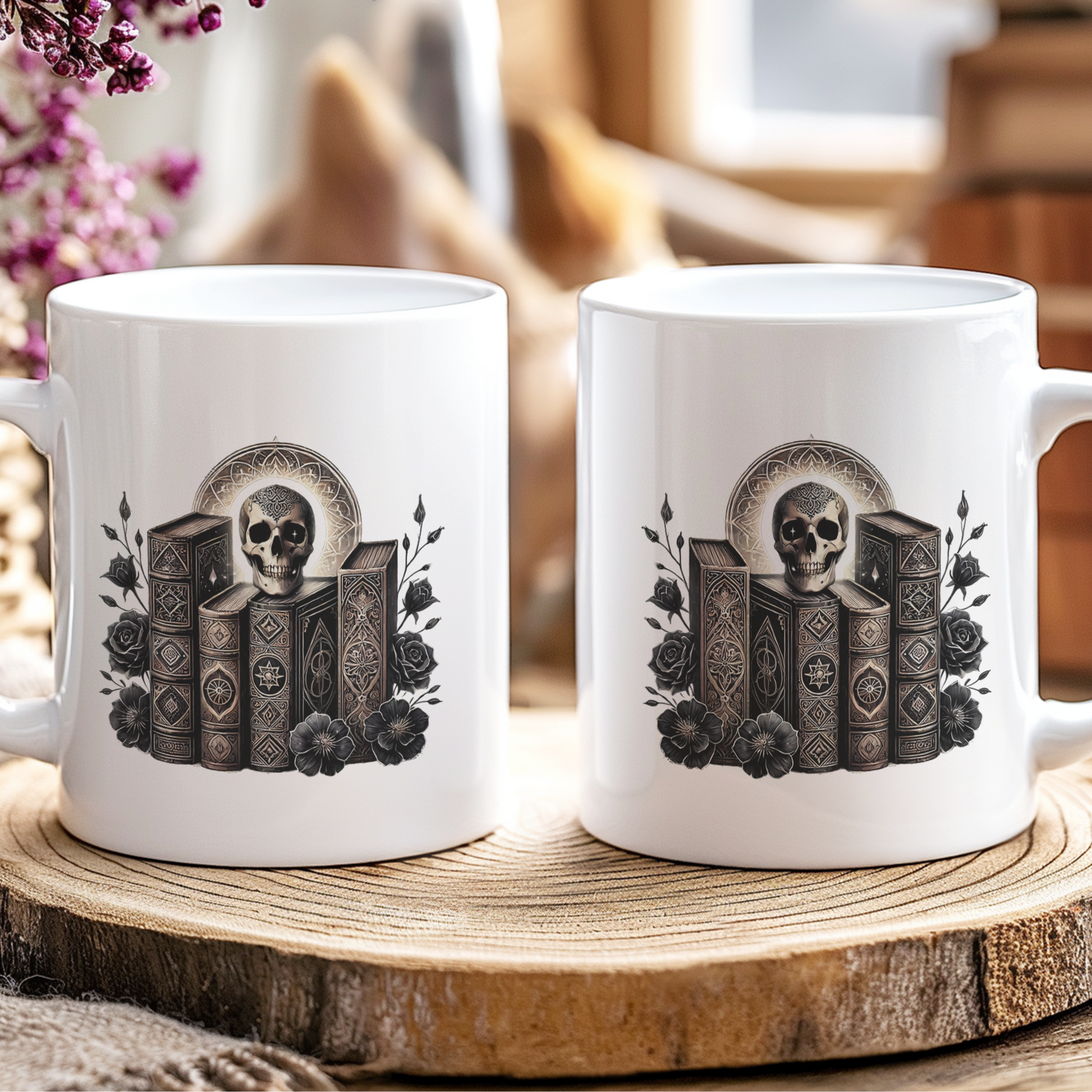 Two white mugs with skull and book design on a wooden coaster.