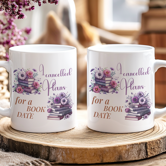 Two white mugs with floral designs and text on a wooden coaster.