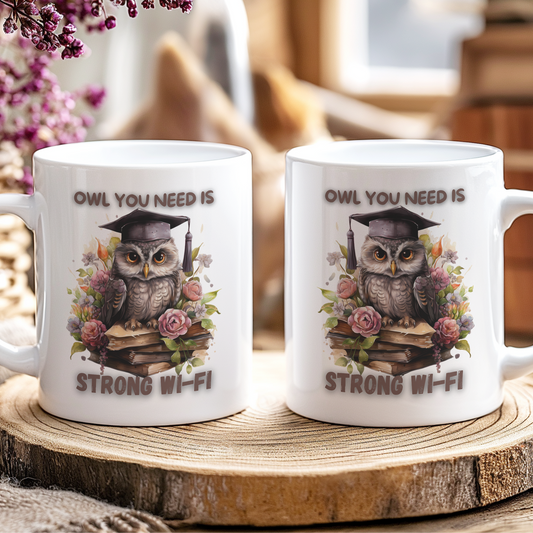 Two mugs with an owl design and text on a wooden coaster.