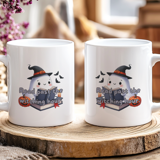 Two white mugs with Halloween-themed design on a wooden coaster.